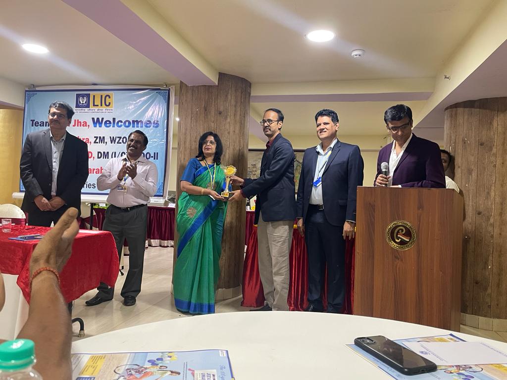 Receiving MDRT trophy from Zonal manager & Marketing manager in Mumbai.