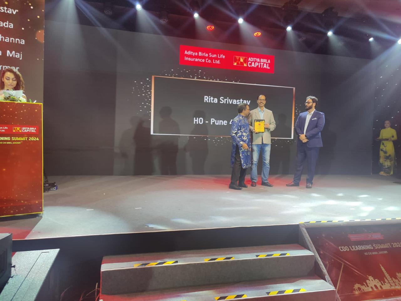 Receiving Birla Sunlife’s CDO club trophy at Ho-Chi-Minh city (Vietnam).